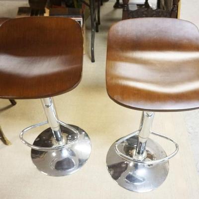 1301A	PAIR OF MODERN STYLE STOOLS ON CHROME BASES, EACH APPROXIMATELY 15 IN X 17 IN X 30 IN HIGH
