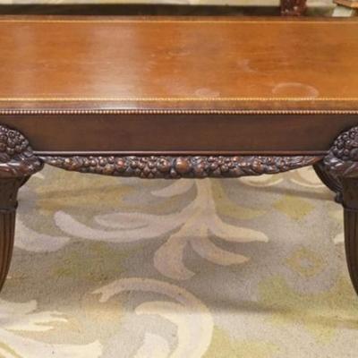 1271	UNUSUAL LEATHER TOP MAHOGANY COFFEE TABLE WITH CARVED CORNUCOPIA LEGS, APPROXIMATELY 42 IN X 23 IN X 18 IN H
