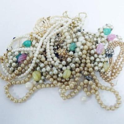 1208	10 PEARL NECKLACES AND 2 PEARL BRACELETS AS FOUND
