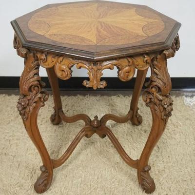 1290B	ORNATE WALNUT LAMP TABLE W/HIGHLY CARVED LEGS & SKIRT, BURL & SATIN WOOD INLAID, APPROXIMATELY 25 IN X 28 IN HIGH
