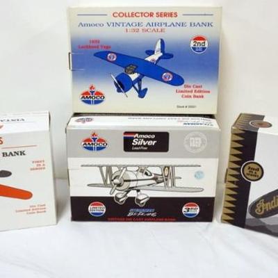 1104	4 DIE CAST AIRPLANE COIN BANKS IN ORGINAL BOXES
