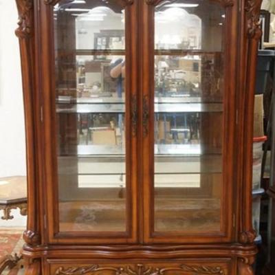 1253	ORNATE FRENCH STYLE 2 PART CRYSTAL CABINET WITH MIRRORED BACK, GLASS SHELVES, INTERIOR LIGHTS AND LOWER DRAWER ON CARVED PAW FEET,...