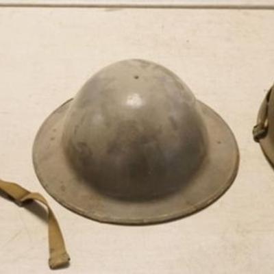 1124	GROUP OF 3 METAL MILITARY HELMETS
