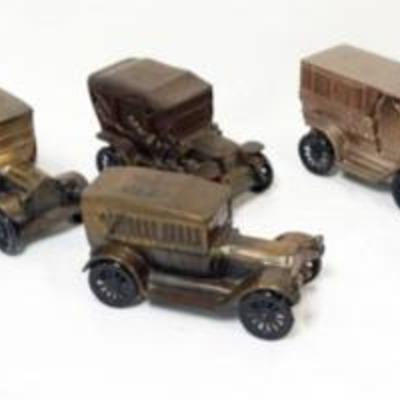 1106	GROUP OF ASSORTED CAST METAL CAR AND RELATED BANKS
