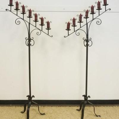 1251	PAIR OF GOTHIC STYLE FLOOR STANDING WROUGHT IRON CANDLEABRAS, ADJUSTABLE IN HEIGHT, EACH APPROXIMATELY 29 IN X 19 IN X 77 IN H

