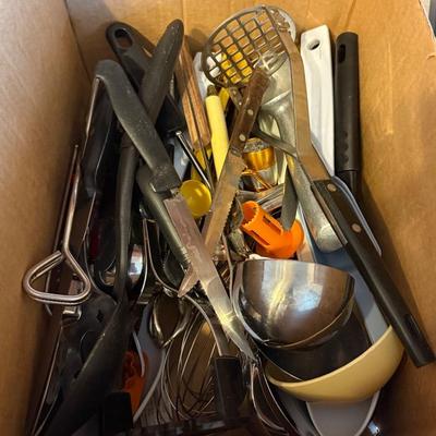 A Large Assortment Of Kitchen Utensils And Knives 