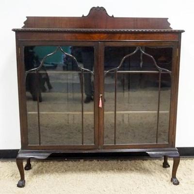 1246	MAHOGANY DOUBLE DOOR BOOKCASE ON BALL AND CLAW FEET AND 2 ADJUSTABLE SHELVES, APPROXIMATELY 50 IN X 14 IN X 54 IN W
