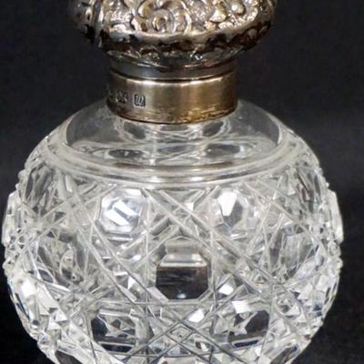 1152	ANTIQUE CUT GLASS PERFUME WITH HINGED SILVER LID AND STOPPER, HALL MARKS, APPROXIMATELY 4 IN H
