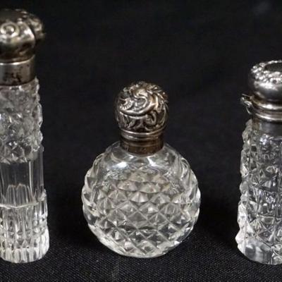 1180	3 SILVER TOPPED CUT GLASS LADIES SCENT PERFUME BOTTLES, TALLEST APPROXIMATELY 3 IN
