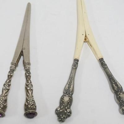 1201	STERLING REPOUSSE SILVER HANDLED LADIES GLOVE STRETCHERS, 1 WITH AMYTHYST JEWEL END, LARGEST APPROXIMATELY 8 IN
