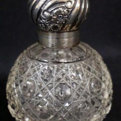 1153	ANTIQUE CUT GLASS PERFUME WITH HINGED SILVER LID AND STOPPER, HALL MARKS, APPROXIMATELY 4 1/2 IN H
