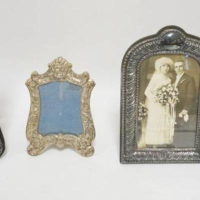 1236	GROUP OF 4 SILVER AND STERLING FACED FRAMES, 1 MARKED POOLE, LARGEST APPROXIMATELY 9 IN X 6 IN
