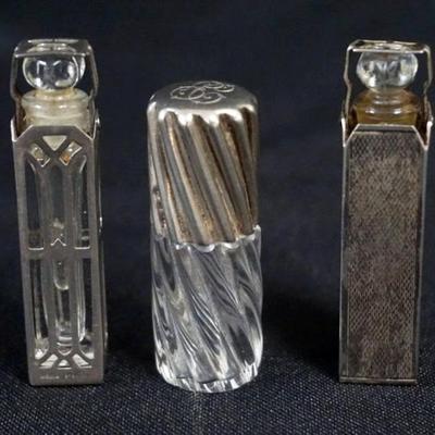 1177	GROUP OF 3 SILVER CASED AND 1 LID PERFUMES, TALLEST APPROXIMATELY 2 1/2 IN
