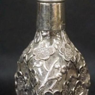 1161	ANTIQUE STERLING SILVER OVERLAY TOOLED PERFUME BOTTLE, FLORAL AND VINE OVER PINCH BOTTLE, APPROXIMATELY 5 IN H
