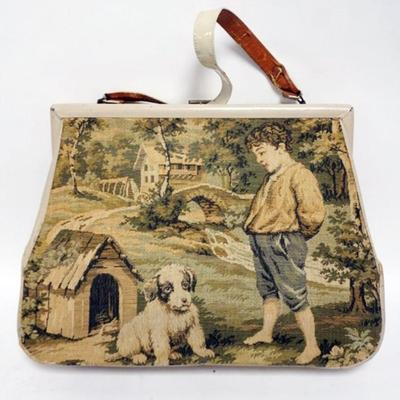 1126	BOBBIE JEROME TAPESTRY PURSE W/IMAGE OF BOY & HIS DOG, SIDE & STRAP WORN, PURSE APPROXIMATELY 14 IN X 13 IN
