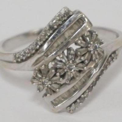 1137	10 K WHITE GOLD AND DIAMOND RING, WOMENS SIZE 12, UNSURE OF TOTAL DIAMOND WT
