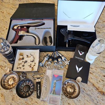 Lot #171 - Wine Lover Lot: Coravin Preservation System, Bottle Stoppers, Openers, Tastevins, Charms, Le Creuset Screwpull