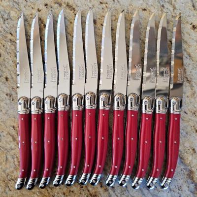 Lot #172 - Set of 12 French Laguiole Jean Dubost Steak Knives w/ Red Handles.