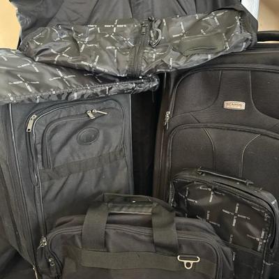 Lot 123:  Mixed Travel Luggage and Garment Bag Set – Ricardo, Delsey, and GBS Brands