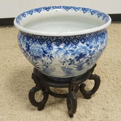 1214	LARGE ASIAN BLUE AND WHITE POT ON WOOD STAND, APPROXIMATELY 19 IN X 21 IN H TOTAL
