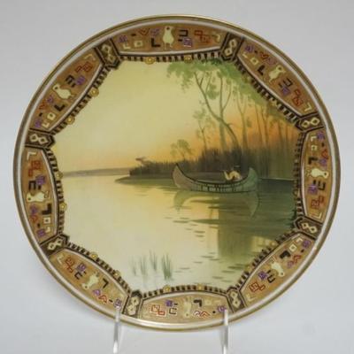 1110	HAND PAINTED NIPPON WALL PLAQUE, IMAGE OF AMERICAN INDIAN HUNTING ELK IN BIRCH CANOE, APPROXIMATELY 10 1/2 IN 
