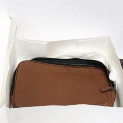 1142	2 COACH PURSES, BROWN LEATHER MF POUCH NEW WITH TAGS AND BROWN LEATHER CLUTCH USED WITH WEAR
