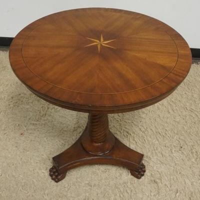 1222	MAHOGANY ROUND LAMP TABLE WITH SPIRAL TURNED COLUMN CENTER, PAW FEET AND STAR INLAID TOP, APPROXIMATELY 28 IN X 27 IN H
