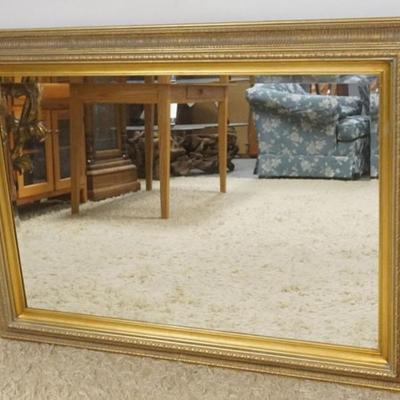1219	BEVELED EDGE MIRROR IN GILT FINISH FRAME, APPROXIMATELY 44 IN X 32 IN
