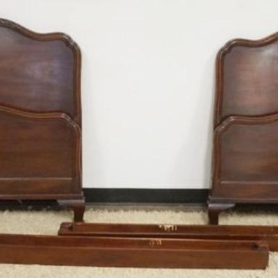 1223	PAIR OF KINDEL MAHOGANY SINGLE BEDS WITH SHELL CARVED CRESTS, EACH APPROXIMATELY 39 IN X 42 IN H X 80 IN L
