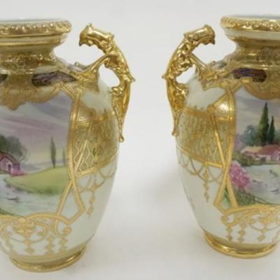 1106	PAIR OF HAND PAINTED NIPPON DOUBLE HANDLED VASES, EACH APPROXIMATELY 10 IN H
