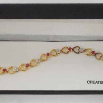 1179	18K GOLD OVER STERLING SILVER CREATED RUBY AND DIAMOND ACCENT BRACELET
