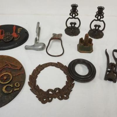1135D	GROUP OF METAL ITEMS INCLUDING FIRE MARKERS, CANDLESTICKS, NUTCRACKER, FRAMES, ETC, LARGEST PIECE APPROXIMATELY 13 1/2 IN
