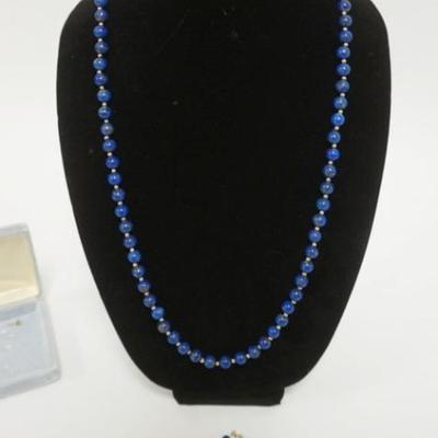 1166	14K GOLD BLUE STONE BEADED NECKLACE SET INCLUDES NECKLACE, BRACELET AND EARRINGS. 1 EARRING NEEDS REPAIR
