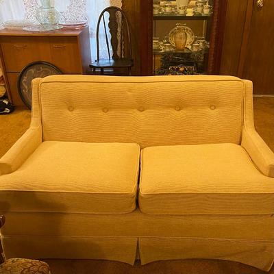 The previous photo more accurately captures the color of both the love seat and sofa.  