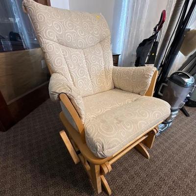 glider chair with a natural wood frame