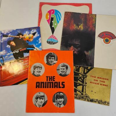 Lot #126 - Vintage Music & Movie Booklet Lot – Jimi Hendrix, Cream, The Animals & Paul McCartney, Bridge on River Kwai