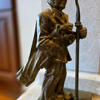 Vintage brass door stop/golfer statue. 