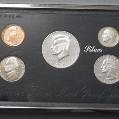1165	UNITED STATES MINT PROOF SET WITH SILVER DOLLAR, QUARTER & DIME
