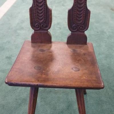1237	ANTIQUE FOLK ART CARVED CHAIR WITH IMAGES OF CRESTS, HAVING SPLAY LEG BASE, APPROXIMATELY 16 IN X 16 IN X 37 IN H
