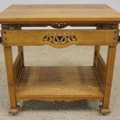 1231	ARTS AND CRAFTS STYLE OAK TABLE WITH TURNED COLUMN SIDES AND SCROLLED SNAKE LIKE CARVED CUT OUT SIDES, APPROXIMATELY 32 IN X 22 IN X...