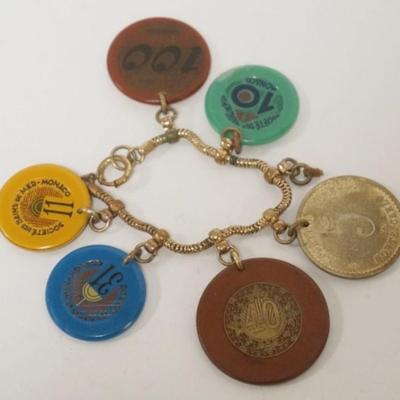 1119	UNUSUAL GAMING CHIP BRACELET WITH CHIPS FROM MONACO, MONTE CARLO, AND OTHERS
