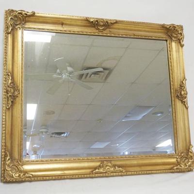 1207	BEVELED EDGE WALL MIRROR IN GILT FRAME, APPROXIMATELY 31 IN X 37 IN
