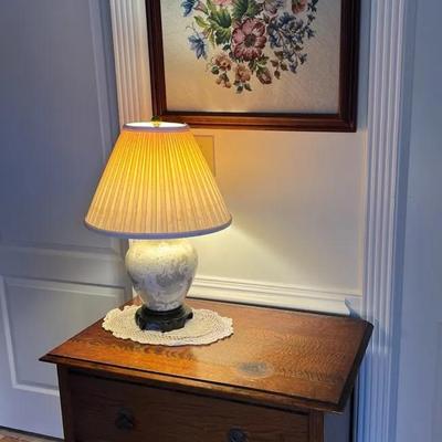 Antique Two Drawer Chest, Framed Floral Needlework & Ceramic Table Lamp
