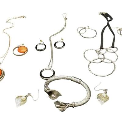 Three Earring Sets With Necklaces And One Earring Set With A Bracelet 