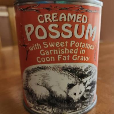 Can Of Creamed Possum With Sweet Potatoes Garnished In Coon Fat Gravy