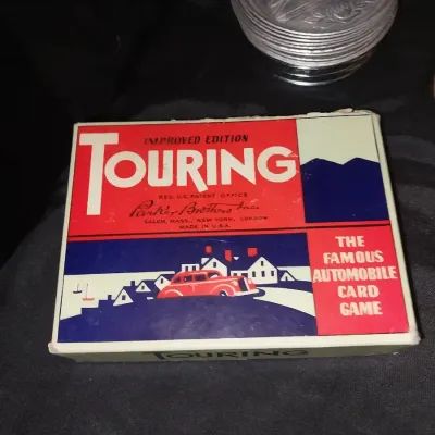 Sale Photo Thumbnail #288: VINTAGE TOURING PLAYIMG CARDS-HANGING SIGNAGE-SMALL COLLECTOR PLATE-CHALKWARE BOOKENDS