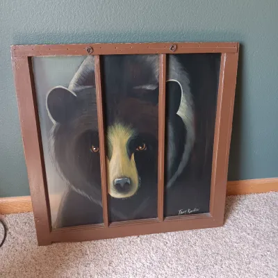OLD REPURPOSED WINDOW WITH BEAR PAINTING, RUSTIC STOOL AND SHARPES ON DVD