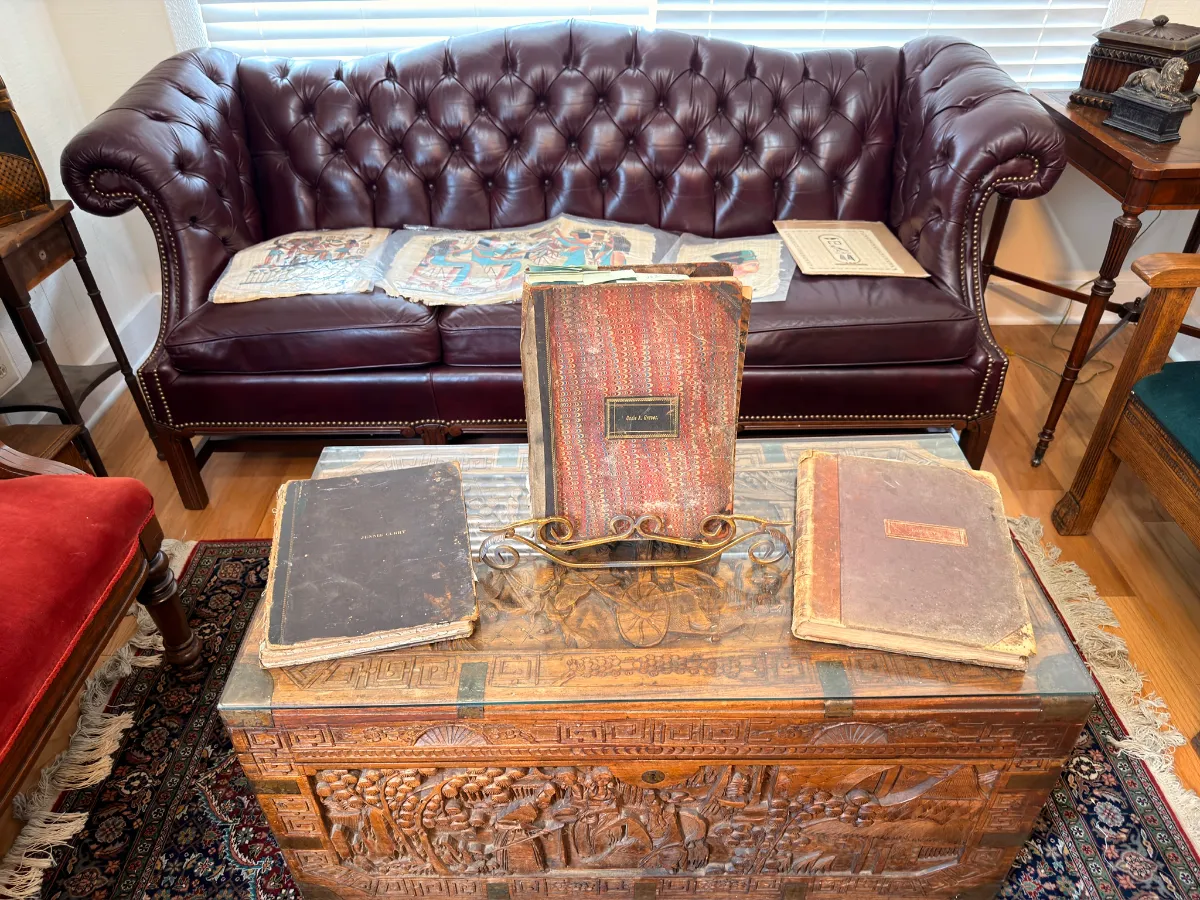 Leather chesterfield sofa and carved chest at an Estate Greats sale in Berry Hill, Tennessee
