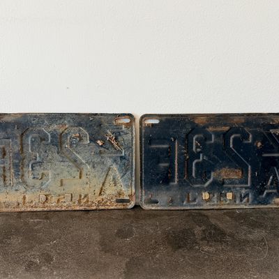 Sale Photo Thumbnail #52: Matching pair of vintage 1956 New Jersey metal license plates, registration number ZA 23F. Each plate features embossed orange characters on a dark background with an attached metal '56' tab (stamped 1665727). Both plates show significant age, surface rus