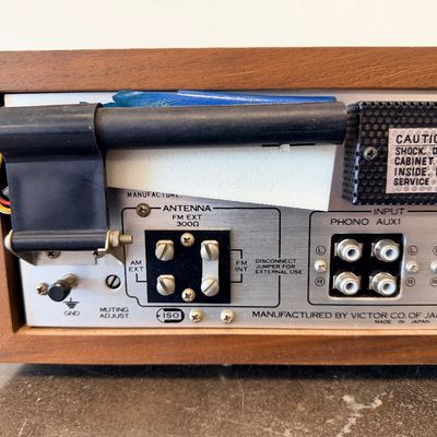 Sale Photo Thumbnail #12: Vintage JVC Model 5020 FM/AM stereo receiver featuring a built-in S.E.A. equalizer control system. Encased in a wood cabinet with a black front panel, illuminated green tuner display, and brushed metal accent trim. Manufactured by Victor Co. of Japan, Ltd